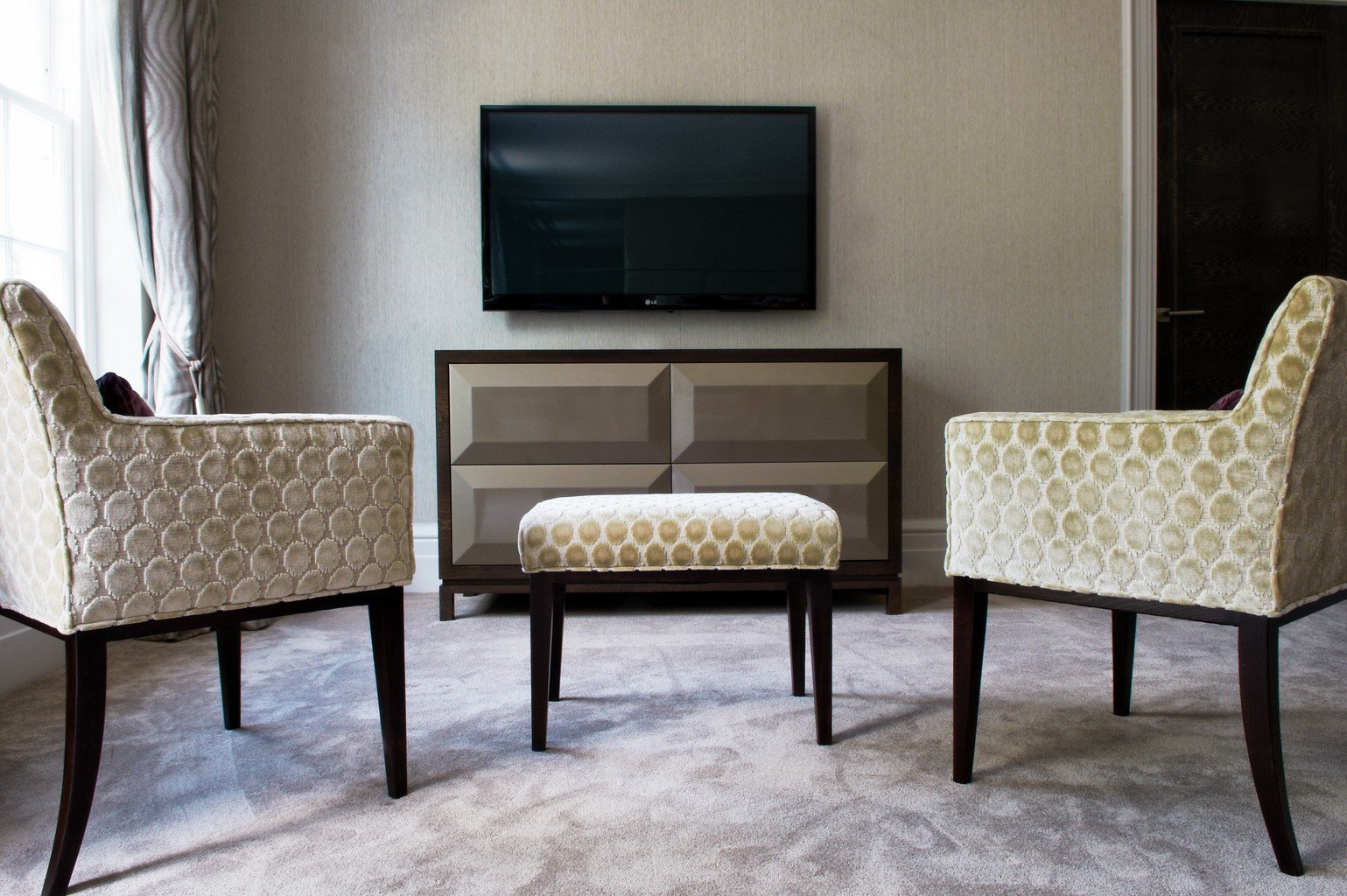 grey luxury carpet and two chairs