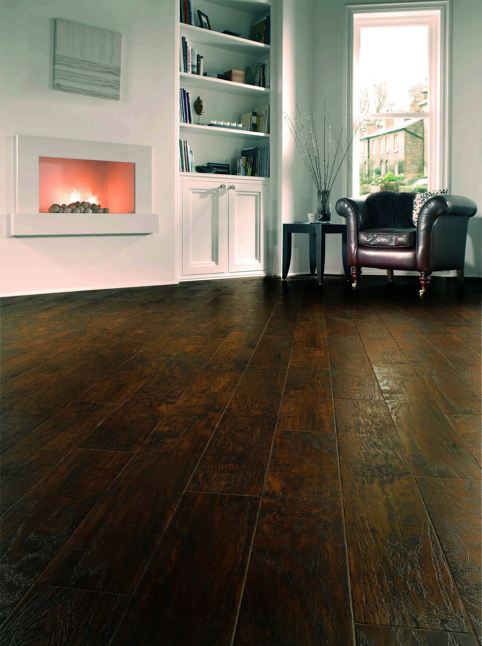 luxury vinyl karndean and amtico flooring with dark leather armchair