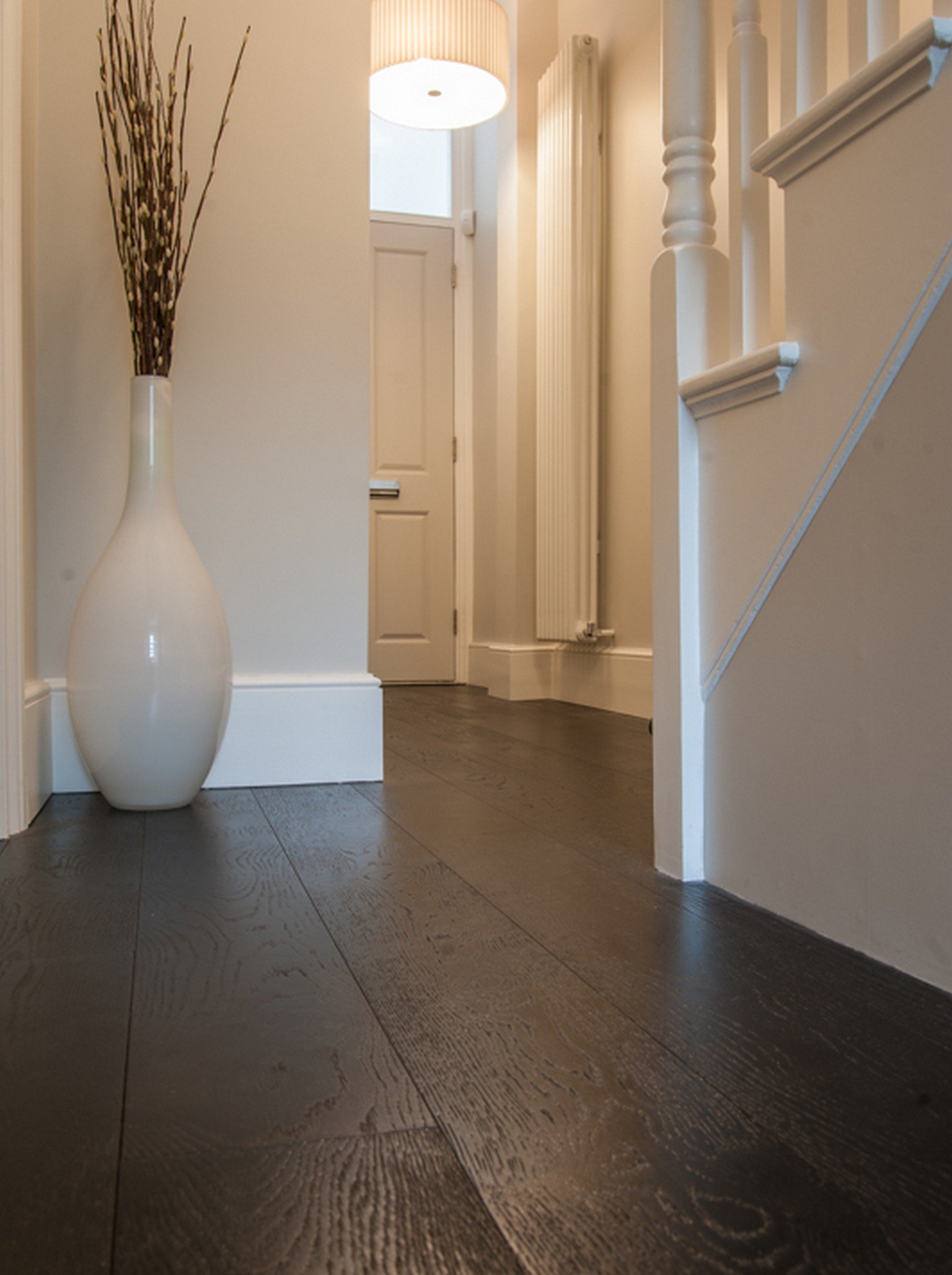 luxury wood flooring and white vase