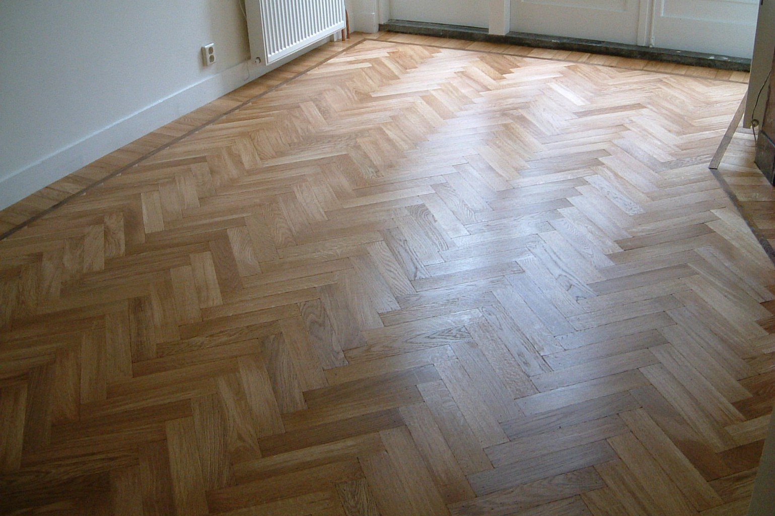 herringbone luxury wood flooring in cream room