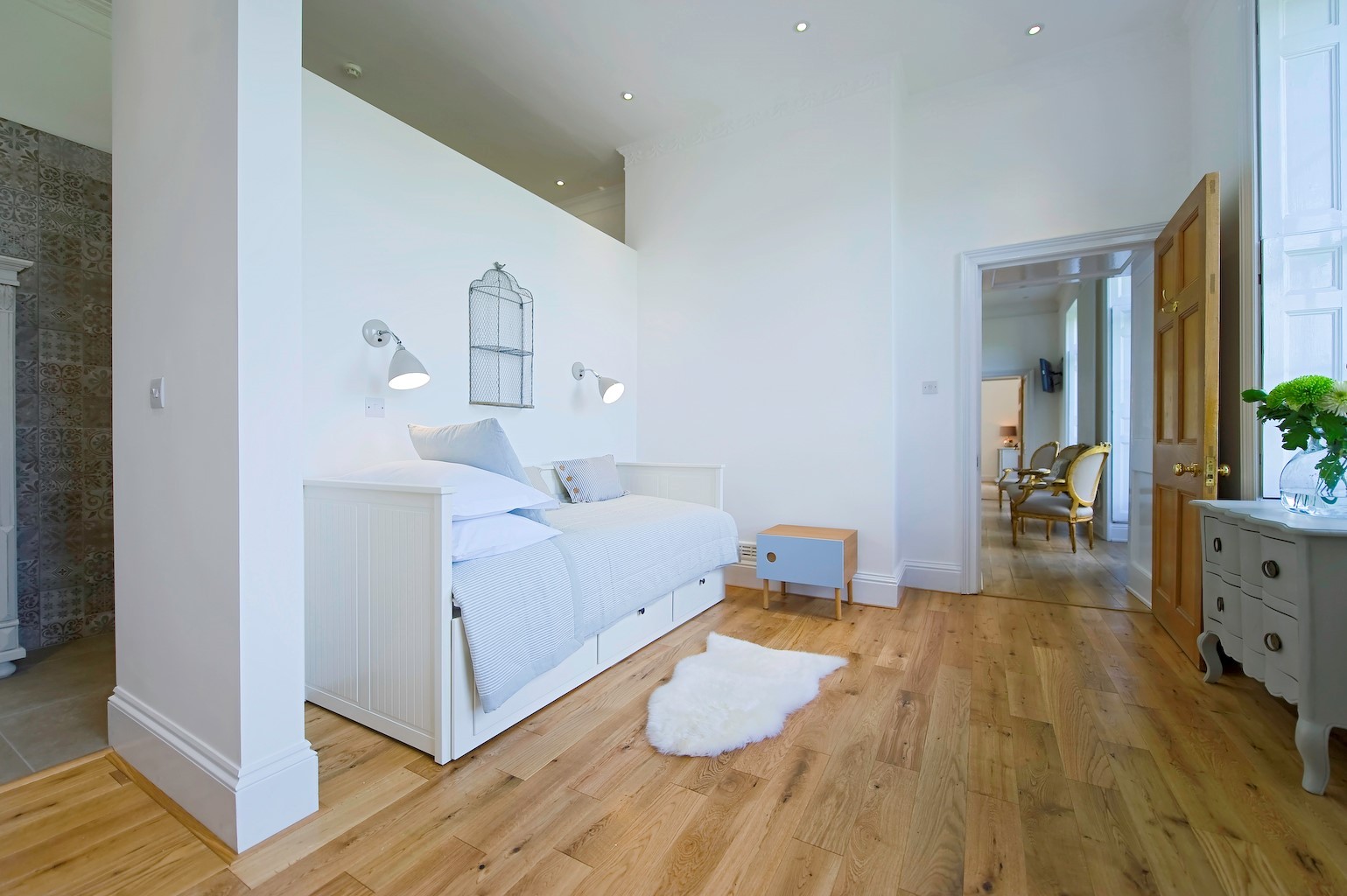 wood flooring and white day bed