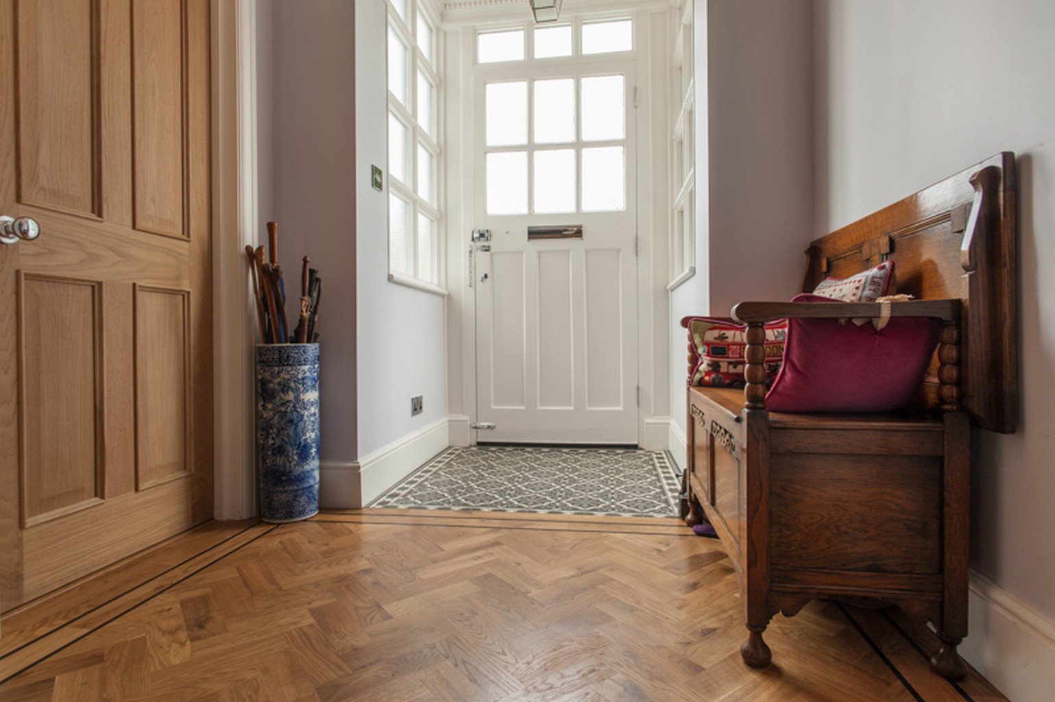 herringbone wood flooring in entranceway